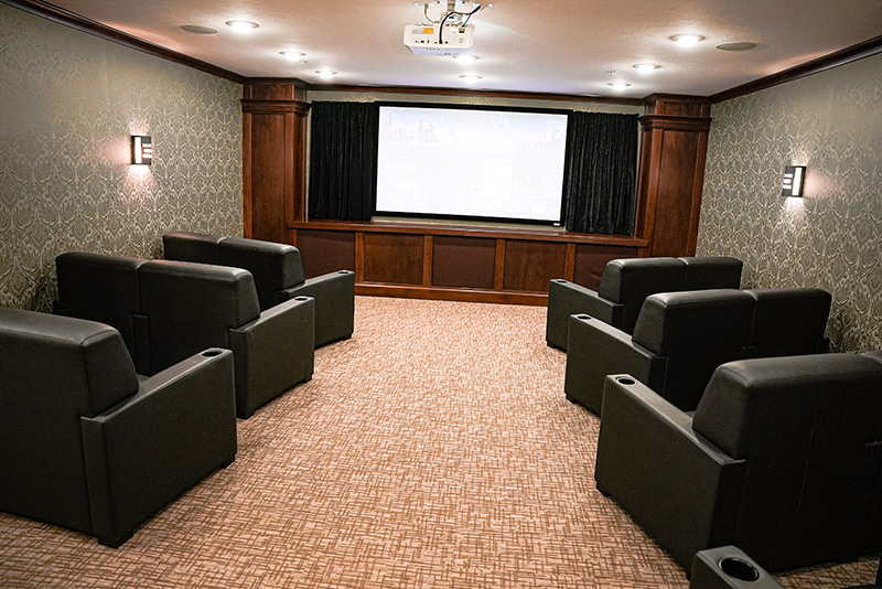 Movie theater room with comfortable leather chairs at Traditions of Lafayette